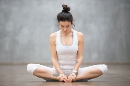 Premium Photo  Athletic woman balancing in yoga pose indoors