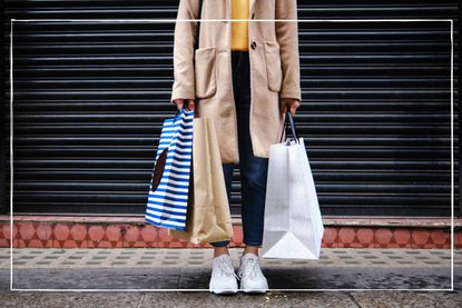 woman on street with shopping bags