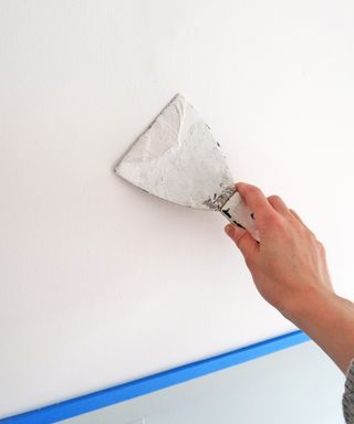 Filler being applied to a wall prior to painting