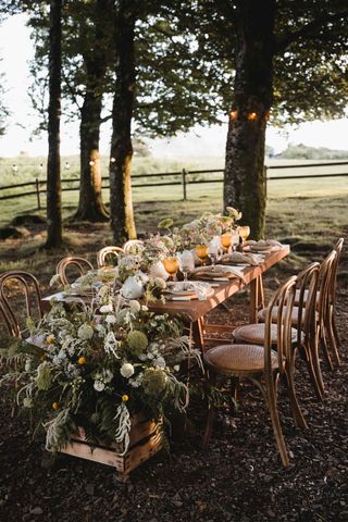 party table for dining ideas with pretty flowers under trees