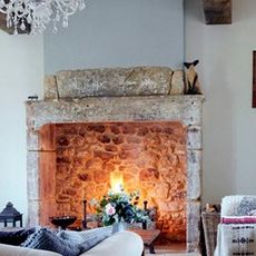 living room with white wall and fire place