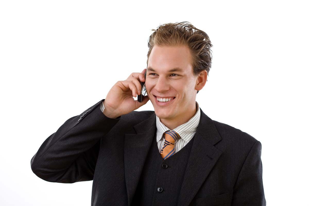 Business user holding mobile phone