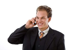 Business user holding mobile phone