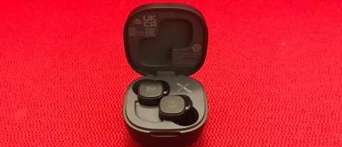 Audio-Technica ATH-SQ1TW earbuds and case on red background