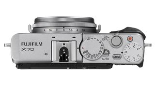It has similar controls to X-series compacts, and a lens ring for aperture adjustment.