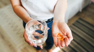 person holding magnesium supplements for anxiety