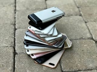 stack of old iphones