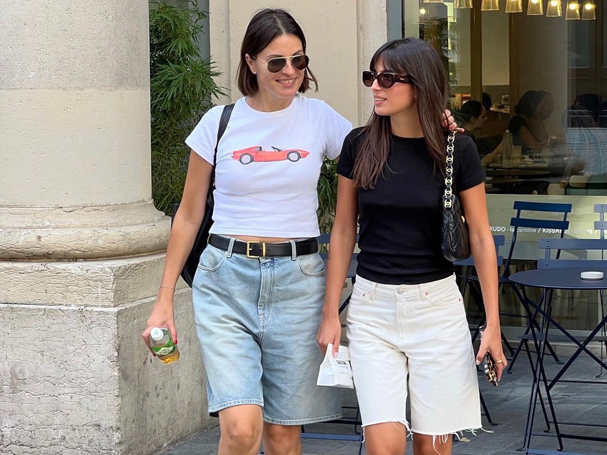 Two women wearing long shorts