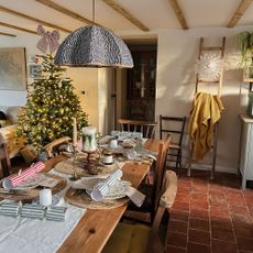 Kitchen with wooden table dressed for Christmas