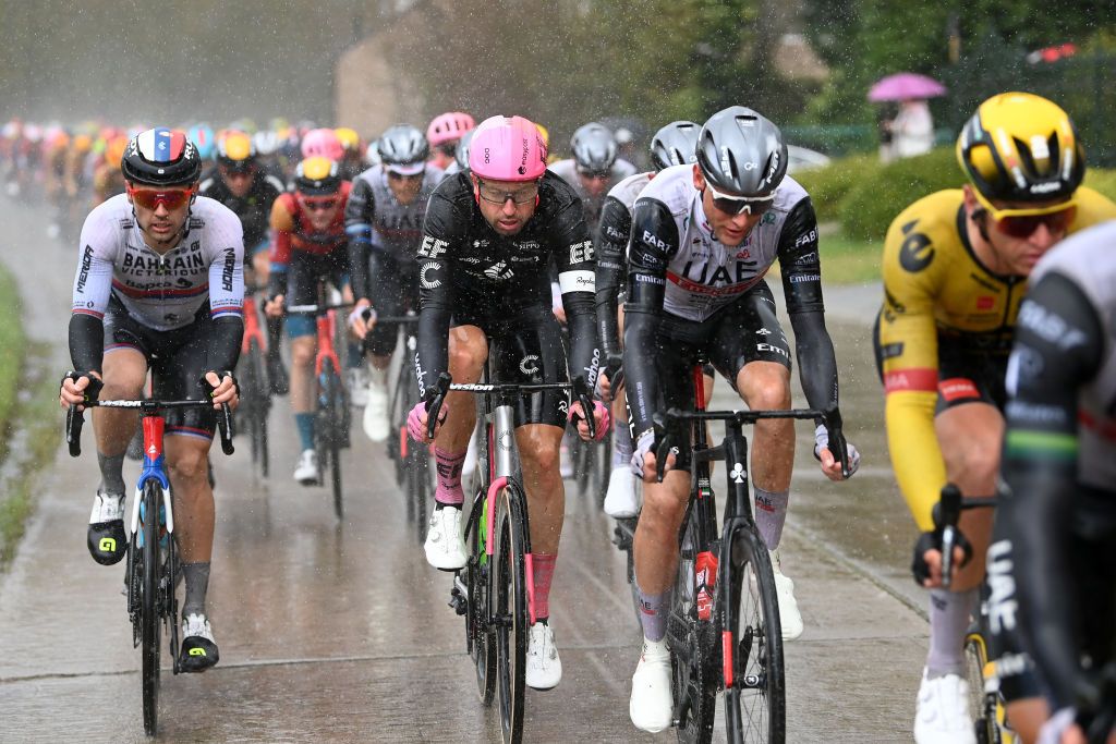 HARELBEKE BELGIUM MARCH 24 LR Duan Rajovi of Serbia and Team Bahrain Victorious and ukasz Winiowski of Poland and Team EF EducationEasyPost compete in heavy rain during the 66th E3 Saxo Bank Classic Harelbeke 2023 a 2041km one day race from Harelbeke to Harelbeke on UCIWT March 24 2023 in Harelbeke Belgium Photo by Tim de WaeleGetty Images