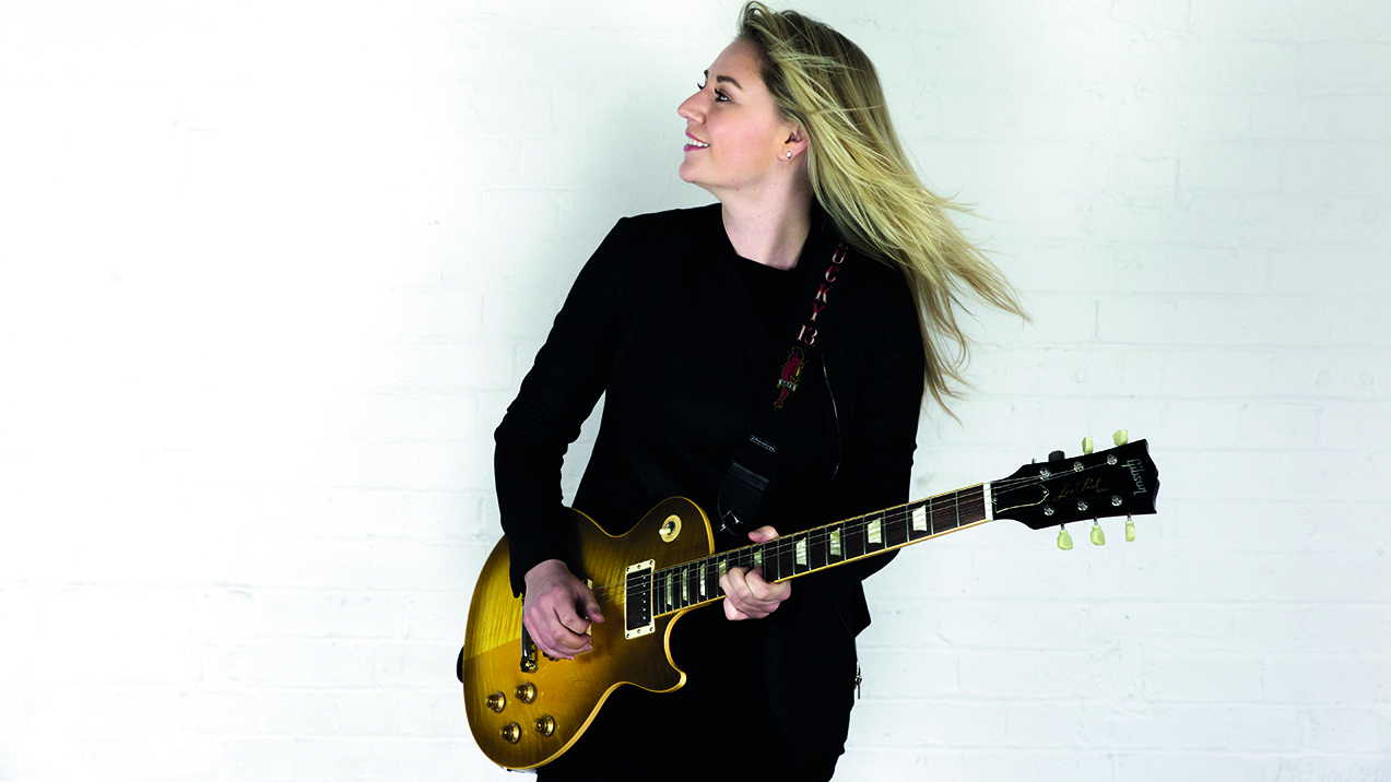 Portrait of Joanne Shaw Taylor wearing a Gibson Les Paul guitar