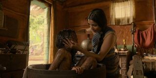 Mowgli: Legend of the Jungle Freida Pinto gives Ronan Chand a bath