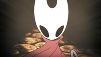 A screencap of a cutscene in Hollow Knight: Silksong. Main character Hornet faces the screen with her white face and angled black eyes. Her red cloak twists in the wind.