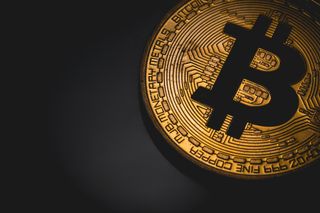 Bitcoin logo on a dark background