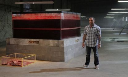 "Fear Factor" host Joe Rogan stands next to a vat of cow's blood: The gag-inducing show returned to NBC Monday for its first episode since 2006.