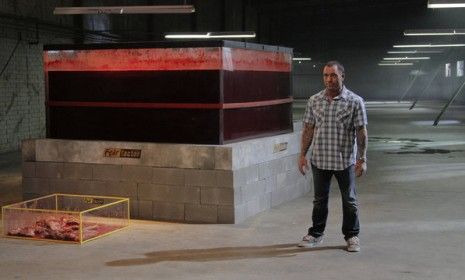 &amp;quot;Fear Factor&amp;quot; host Joe Rogan stands next to a vat of cow&amp;#039;s blood: The gag-inducing show returned to NBC Monday for its first episode since 2006.