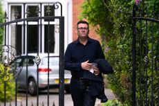 Andy Burnham, here shown leaving his home, wants a land value tax