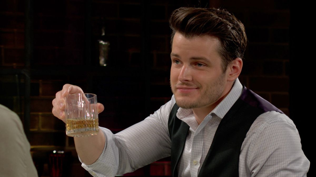 Michael Mealor as Kyle raising his glass for a toast in The Young and the Restless