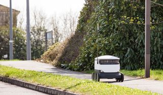 A Starship robot carries out its delivery.