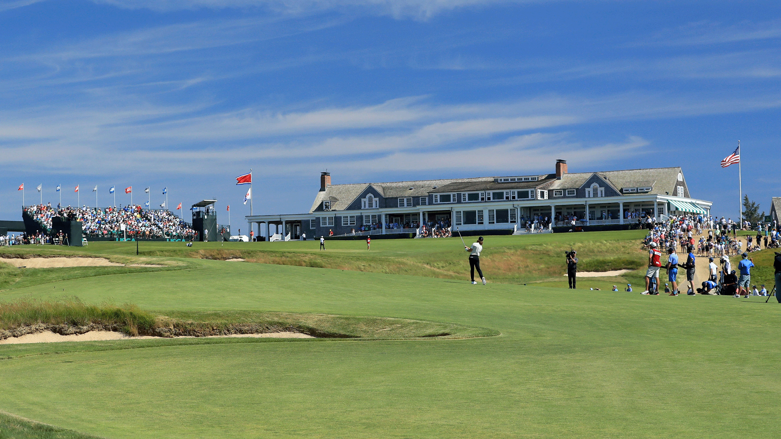 Tommy Fleetwood plays a wedge shot into the 18th green at Shinnecock Hills during the final round of the 2018 US Open