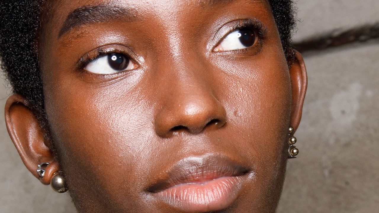 A woman with a clear complexion illustrating a guide to the best medical-grade skincare