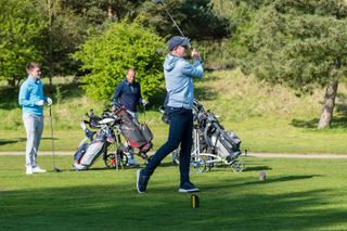 Golfer swinging a club