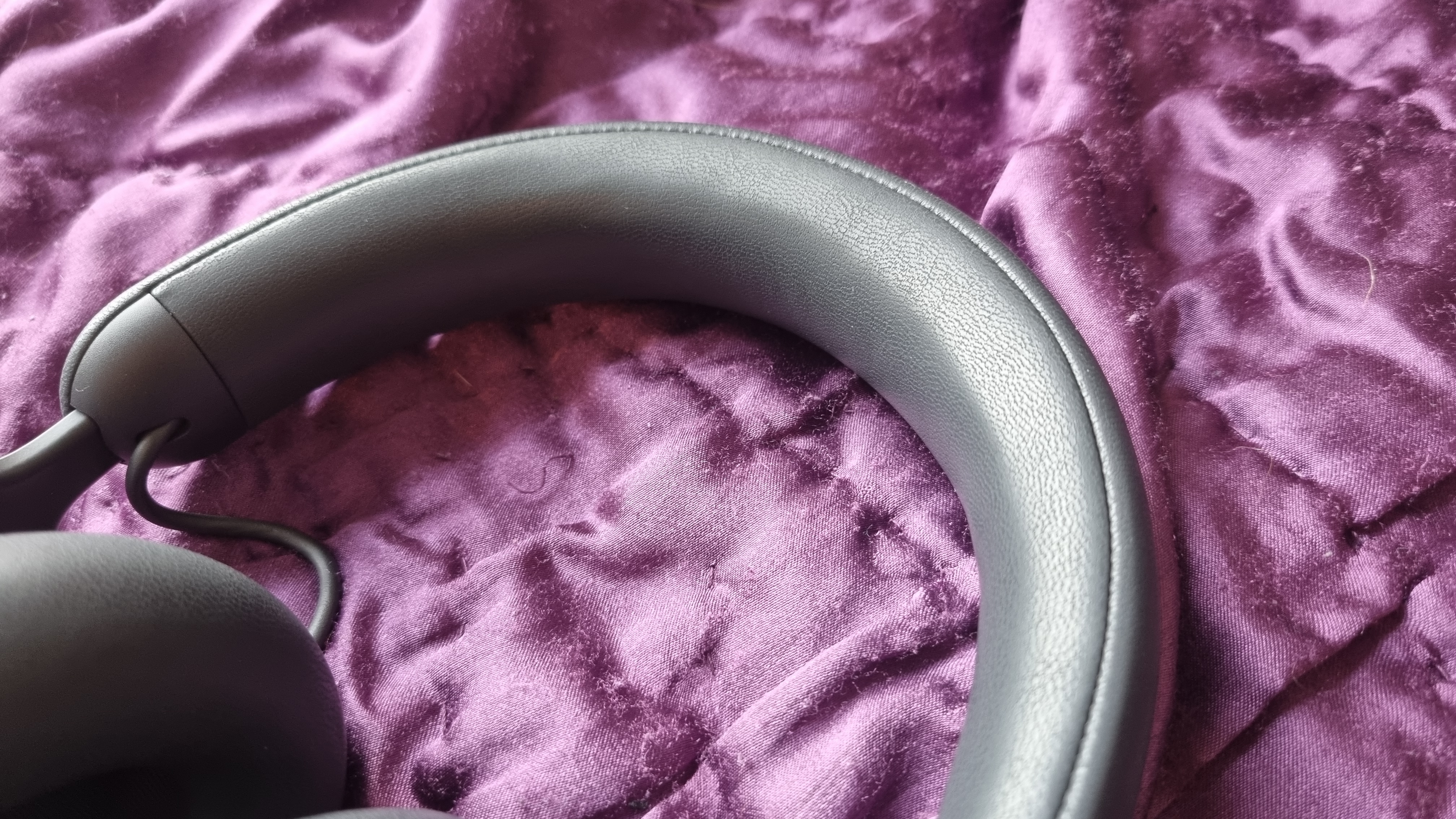 The Alienware Pro Wireless Gaming Headset on a purple background.