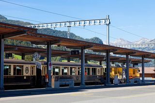 The railway station and Goldenpass train in Gstaad