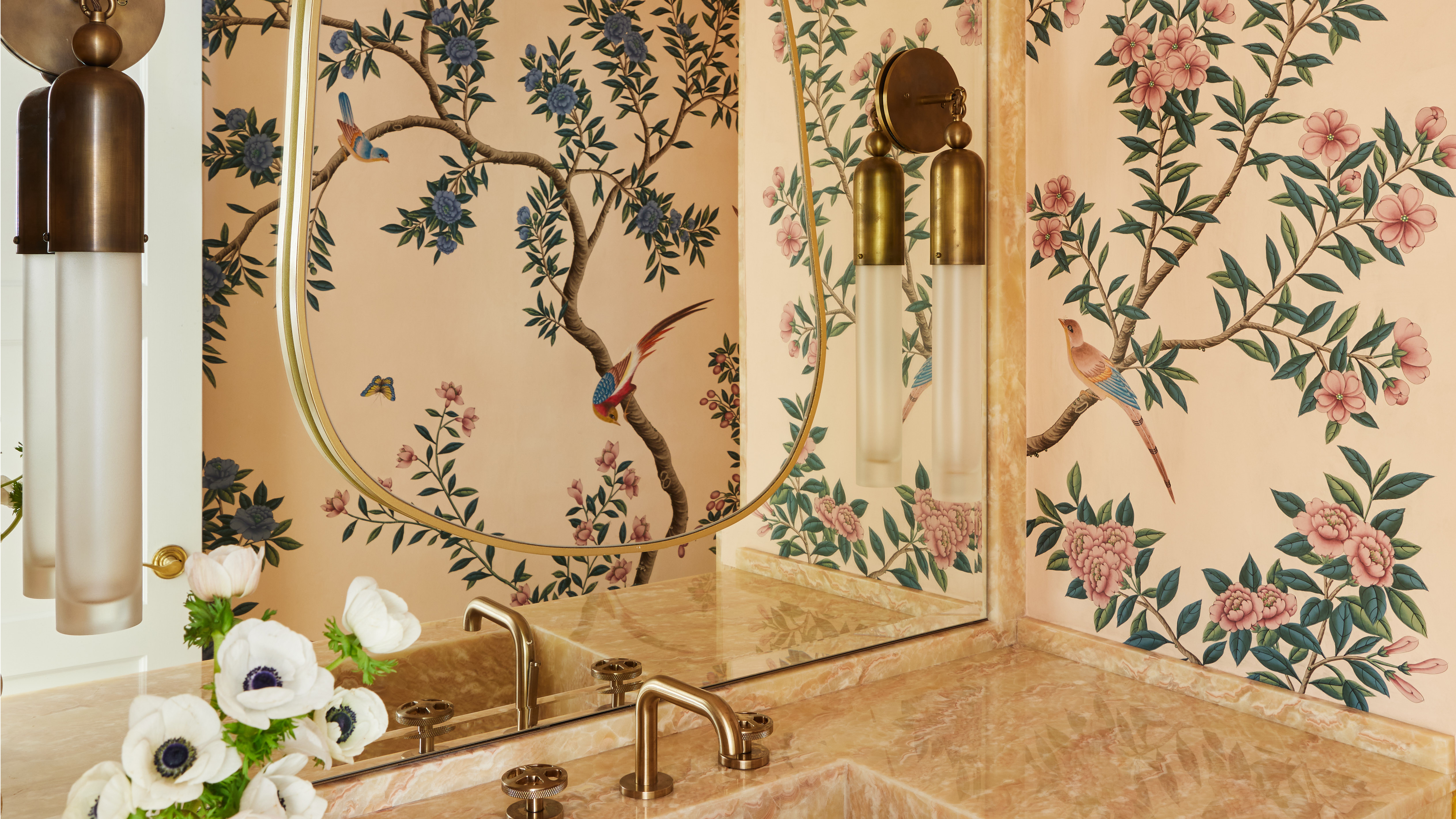 bathroom with marble vanity and floral wallpaper