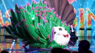 Leaf Sheep singing on stage in The Masked Singer