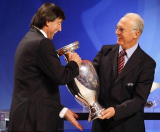 Former Czechoslovakia captain Anton Ondrus is handed the European Championship trophy by legendary West Germany skipper Franz Beckenbauer ahead of the Euro 2008 draw.