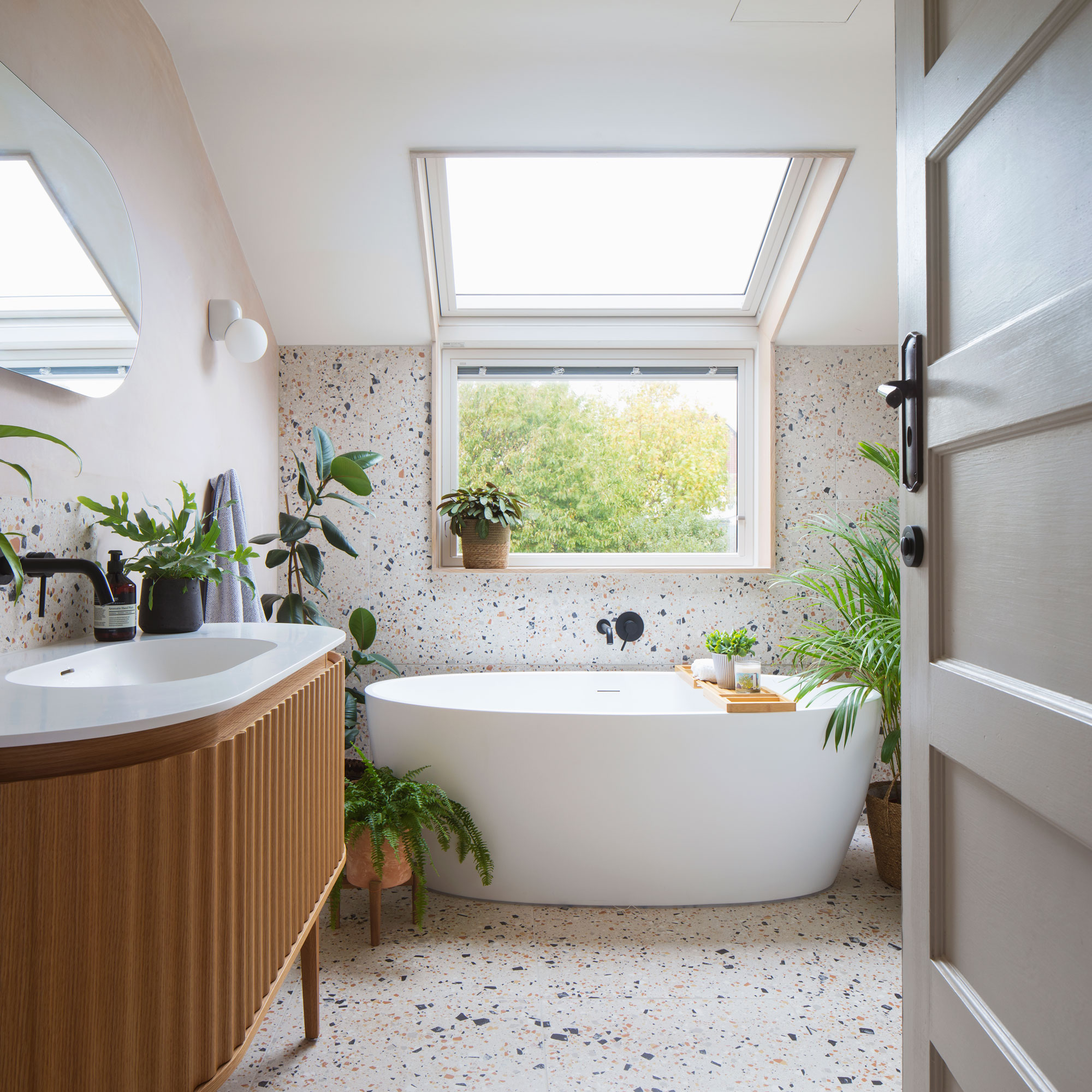 Terrazzo bathroom tiles with bathtub and vanity