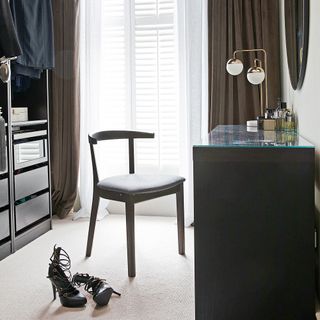 Grey walk-in wardrobe with dressing table