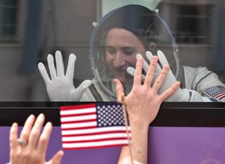 NASA astronaut Serena Aunon-Chancellor gestures from inside a bus before the launch of the Soyuz MS-09 spacecraft at the Russian-leased Baikonur cosmodrome on June 6, 2018.