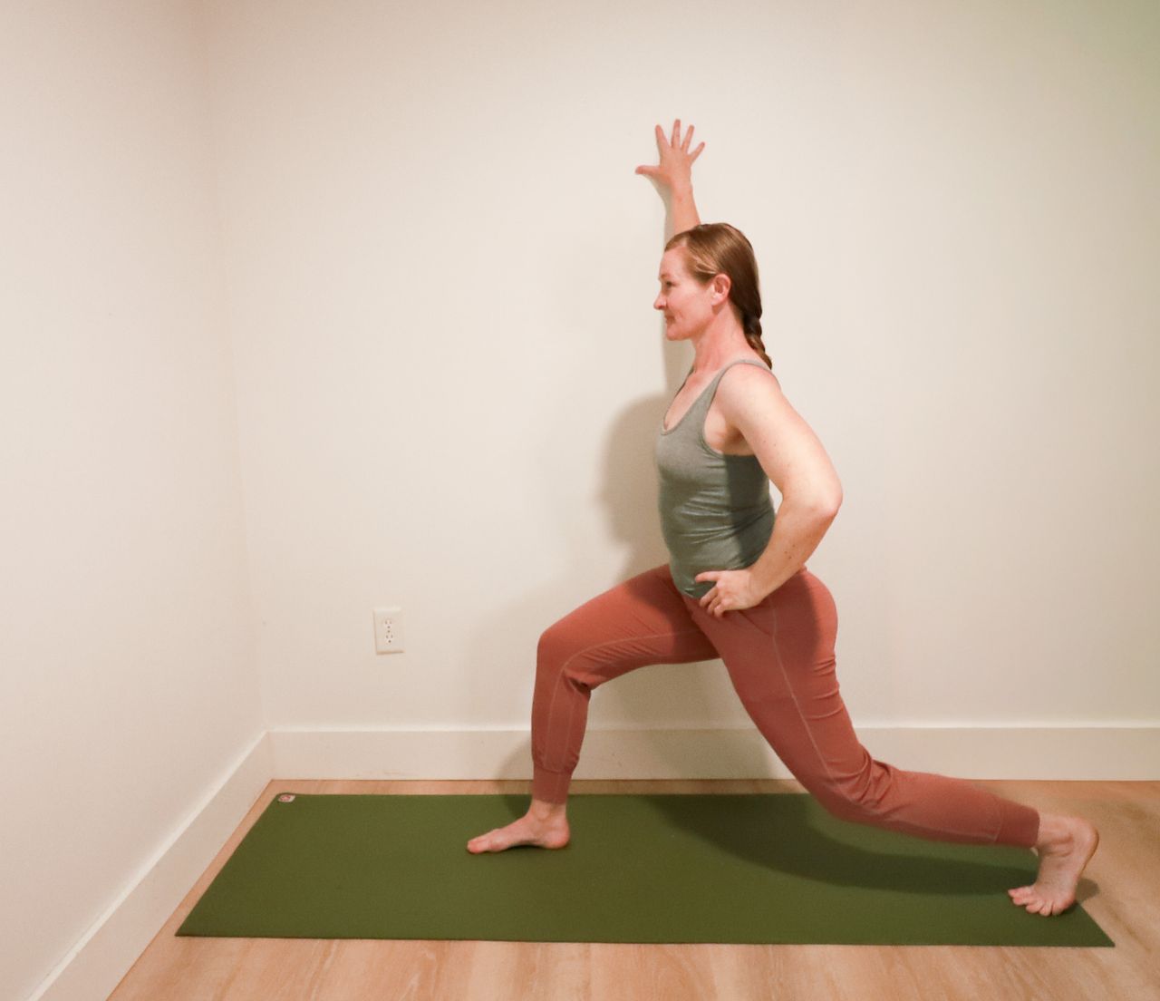 Woman demonstrates yoga pose