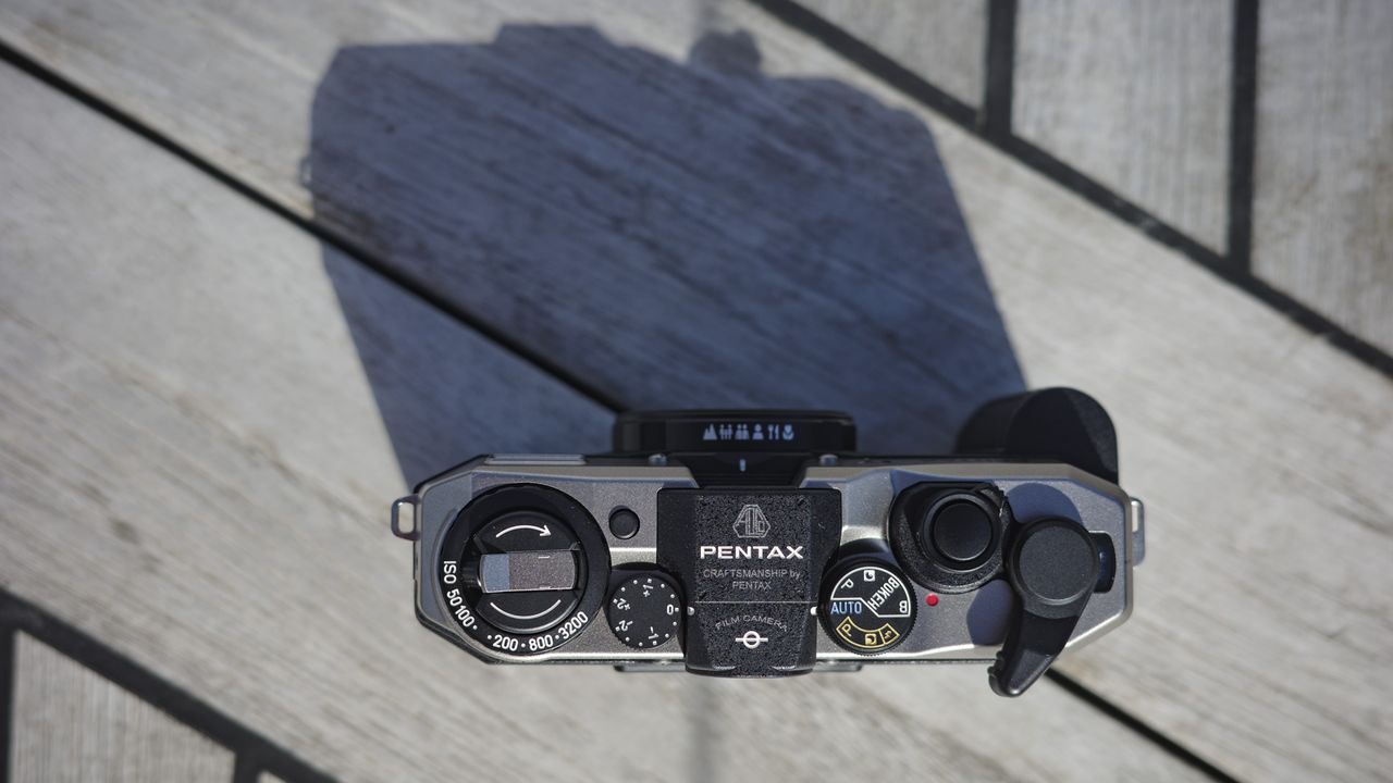 Pentax 17 compact film camera top down on boat deck