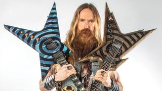 Zakk Wylde poses with guitars