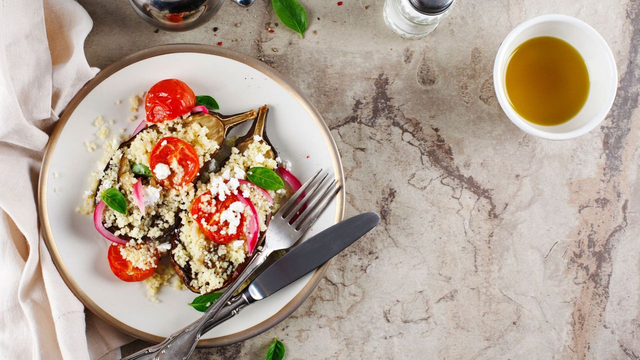 Plate of cous cous on a kitchen countertop