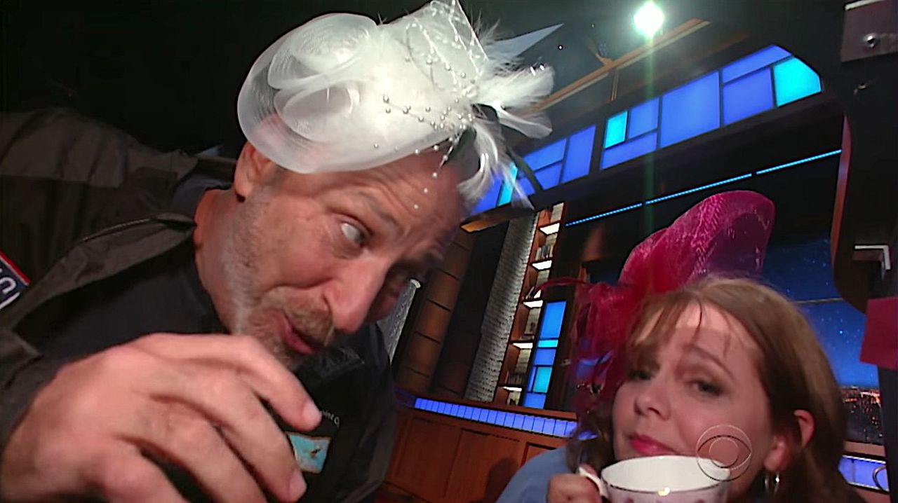 Jon Stewart and Rachel under Stephen Colbert desk