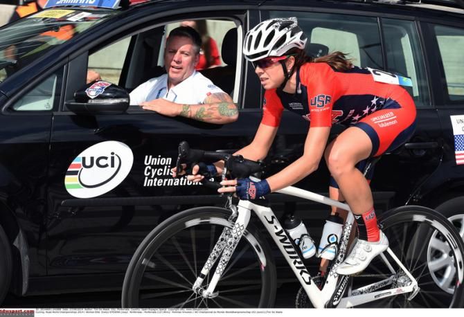 Evelyn Stevens drops back to the USA team car to talk tactics