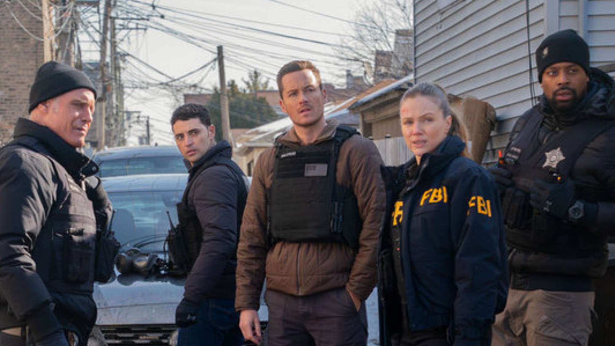 Voight, Torres, Halstead, Upton, and Atwater standing next to each other on Chicago P.D. for the One Chicago crossover.