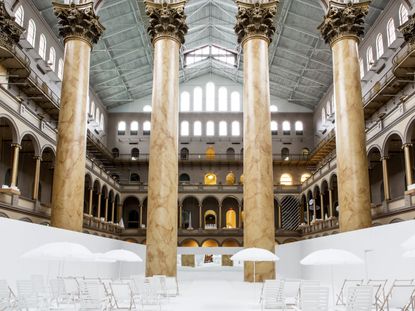 Four gigantic marble columns in National building museum in Washington DC showing beach display