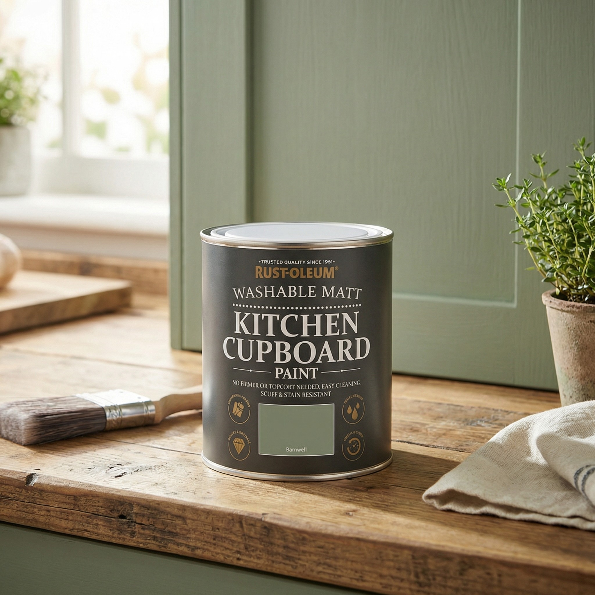 Dulux Quick Dry Satinwood on a wooden worktop in front of a green cabinet