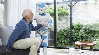 Image of Romeo robot assisting an elderly man