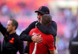Liverpool manager Jurgen Klopp hugs James Milner