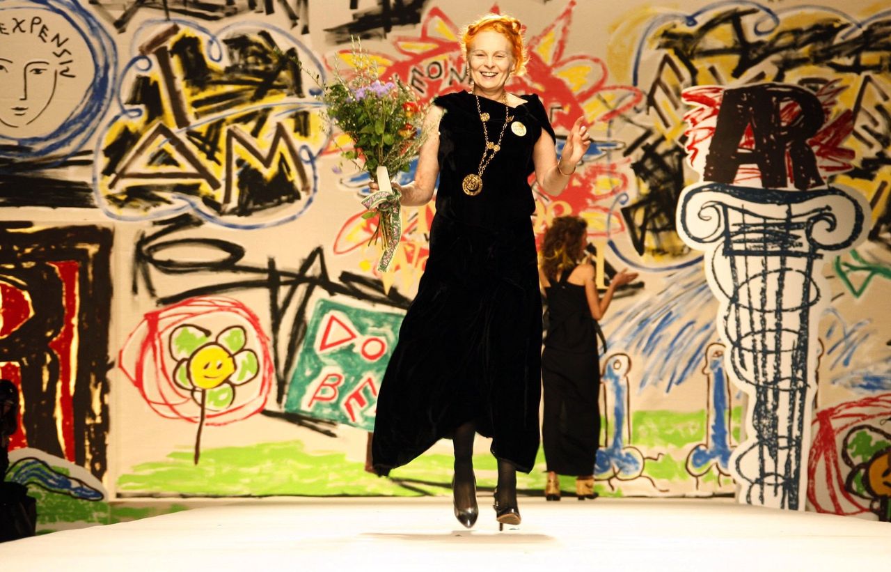 Vivienne Westwood on runway with handdrawn background