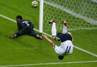 Miroslav Klose performs his acrobatic celebration after scoring for Germany against Saudi Arabia at the 2002 World Cup.