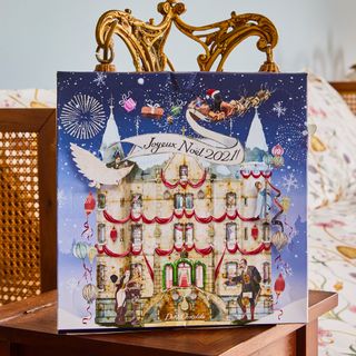 a joyeux noel advent calendar sitting on a wooden bedside table
