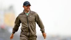 Rory McIlroy in a beige rain suit on the final day of the 151st Open Championship