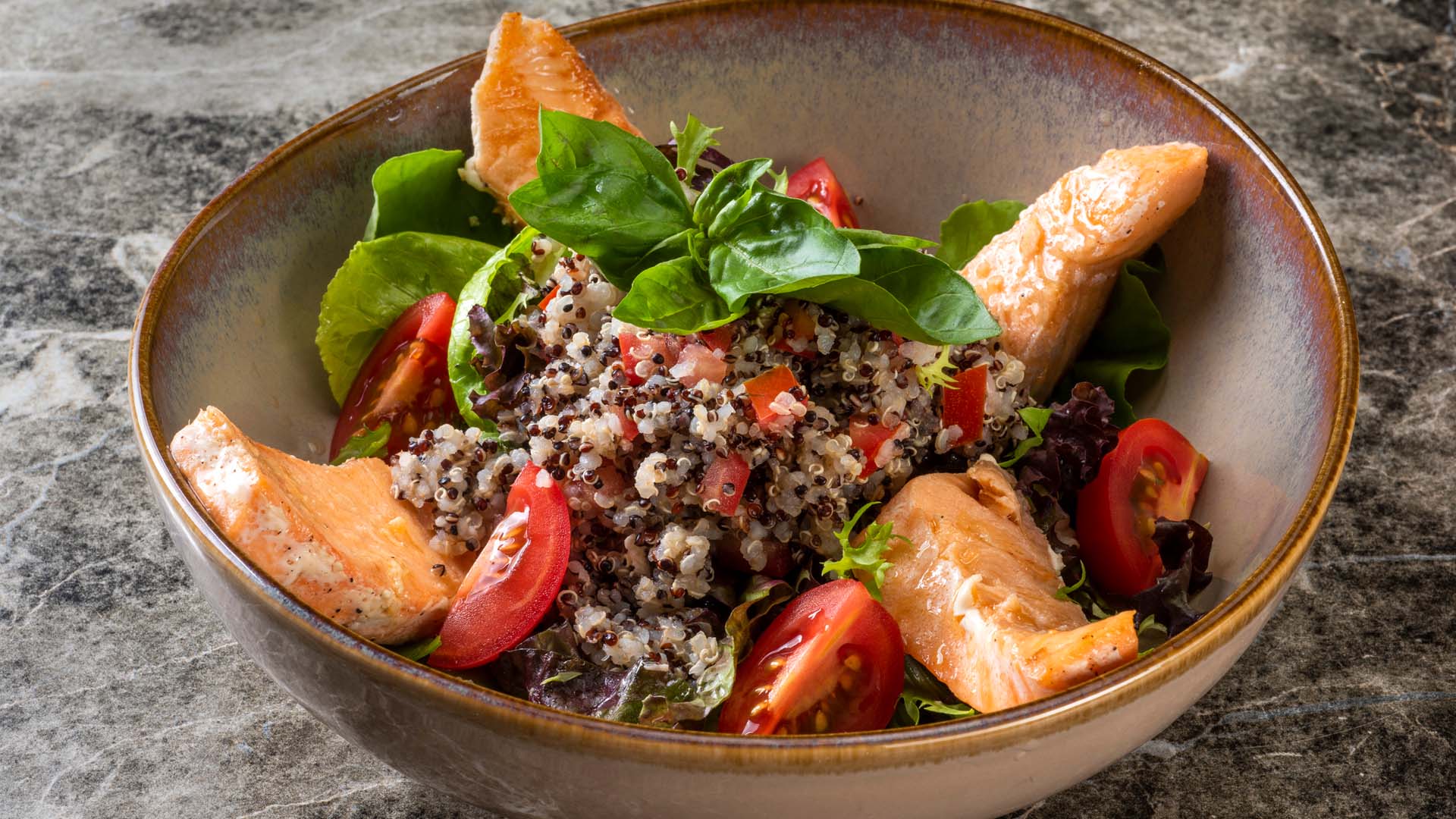quinoa and salmon salad with tomatoes and avocado